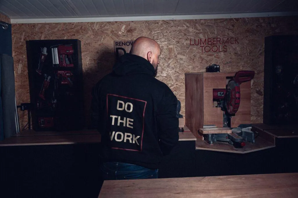 Back of the black 8x8 Do The Work hoodie showing the large boxed graphic.