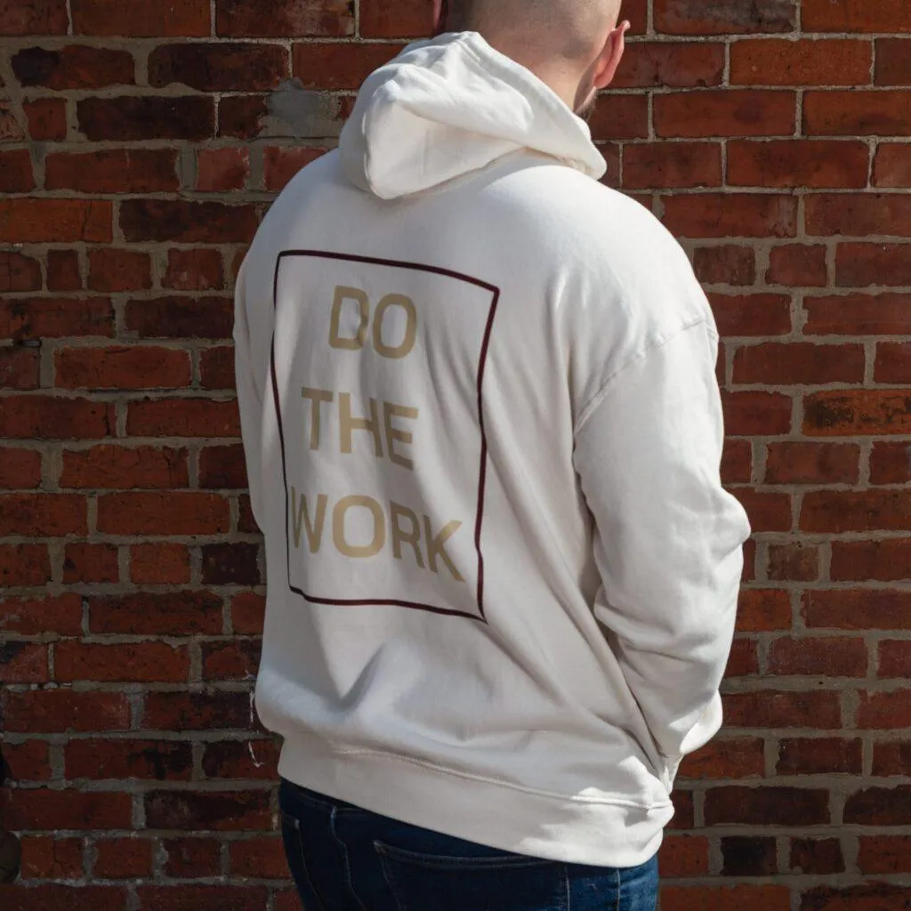Three-quarter back view of the Natural Raw 8x8 Do The Work hoodie showing the large boxed graphic.